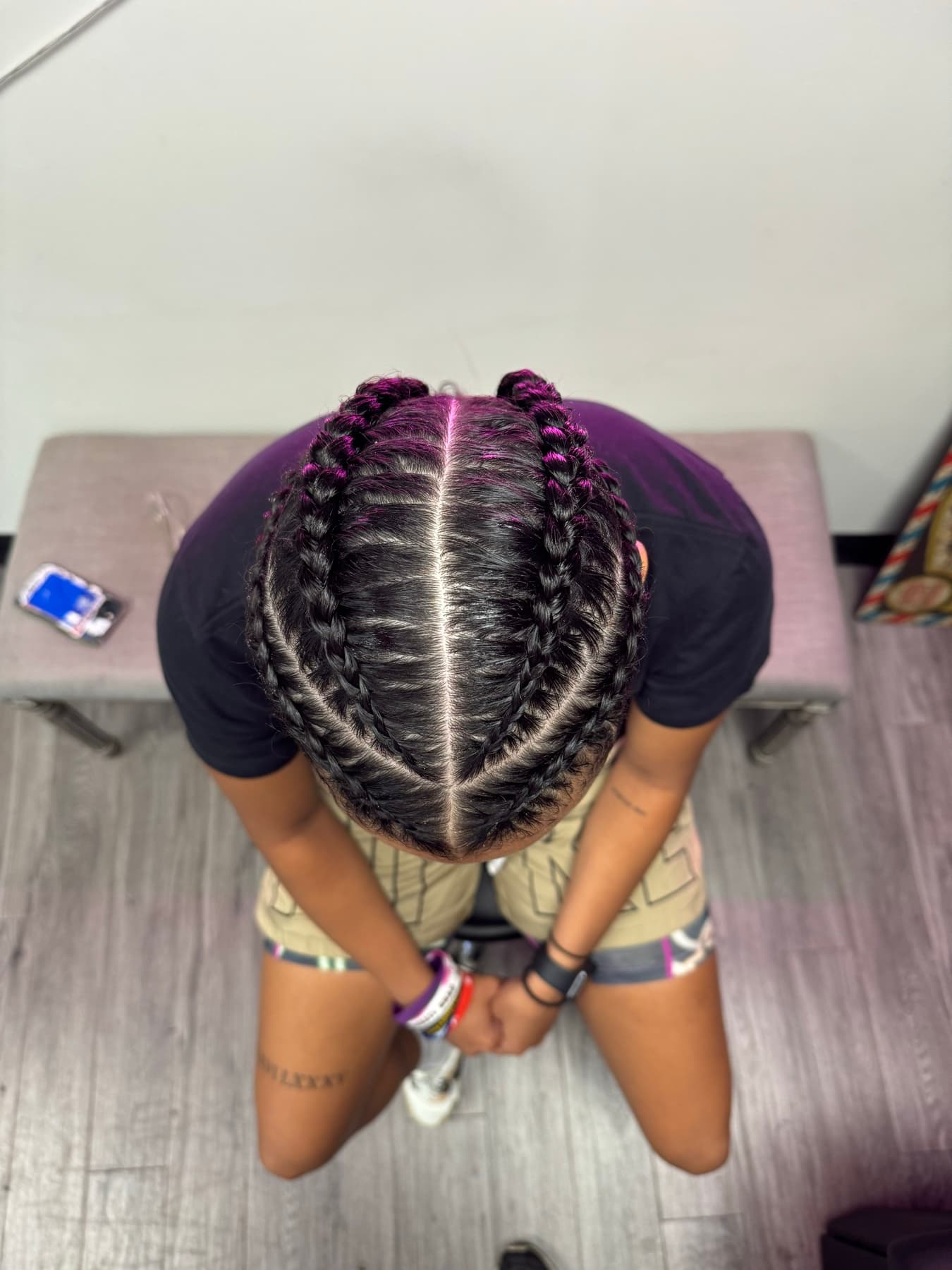 Braids with purple highlights seen from above