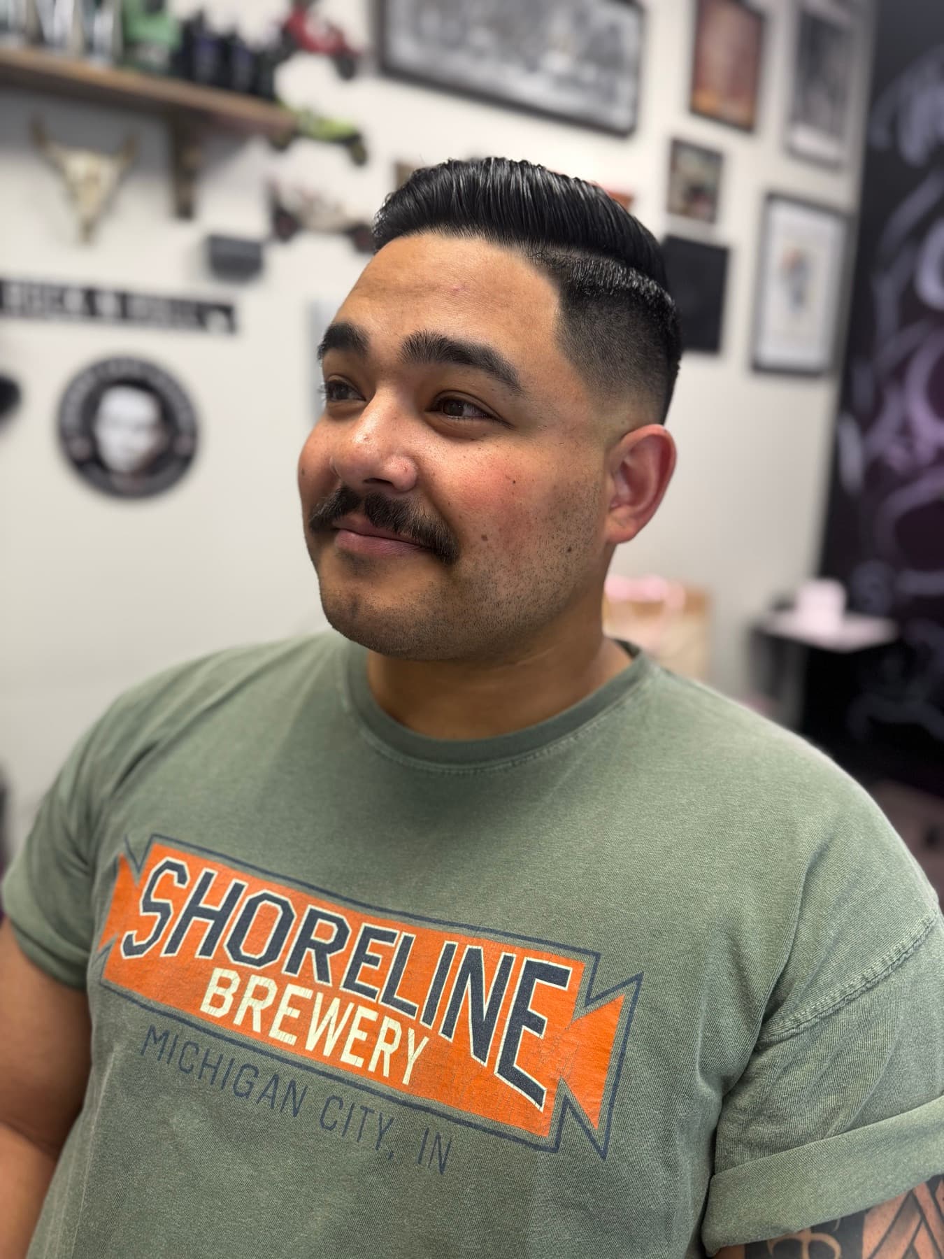 Client with a fresh slick-back fade and moustache in the shop
